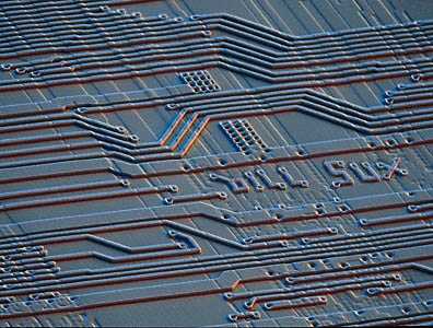 Image. Electron photomicrograph of part of the circuitry of the Pentium processor. The words "bill sux" can be seen on the surface of the chip